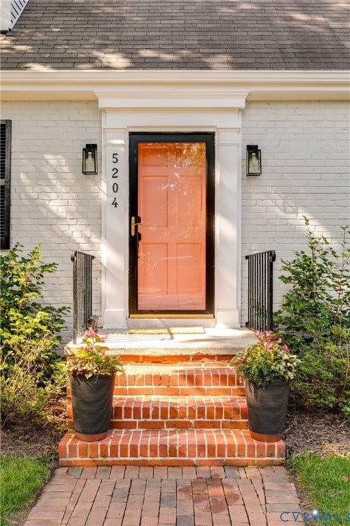 5204 Caledonia Road, Westover Hills, Richmond, VA 23225 Painted brick exterior with a prominent coral entry door