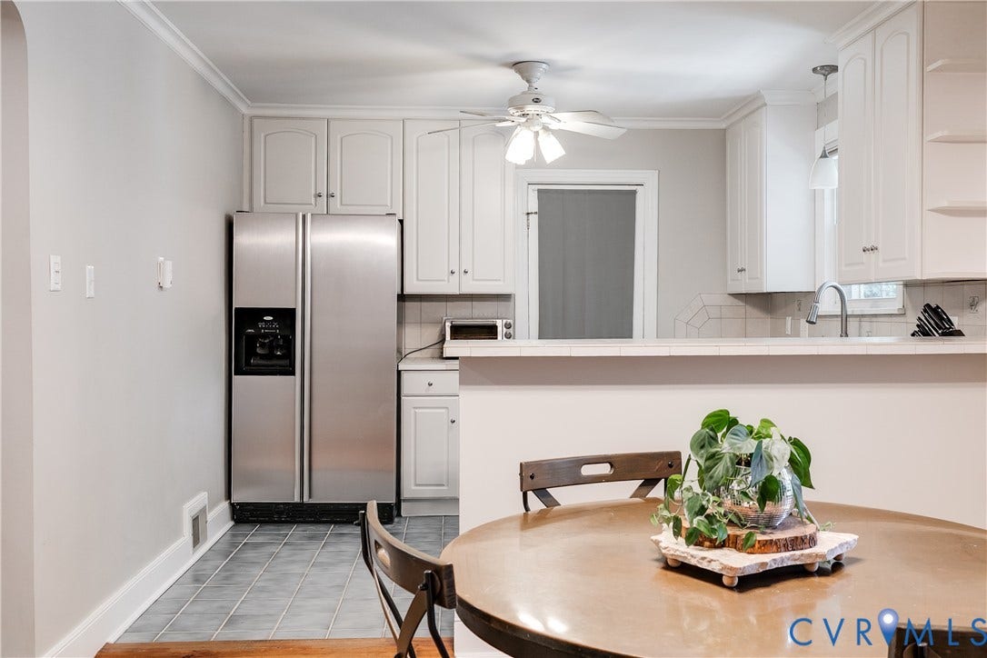 5204 Caledonia Road, Westover Hills, Richmond, VA 23225 Stainless steel refrigerator, white cabinetry, tile flooring, built-in counter, and ceiling fan