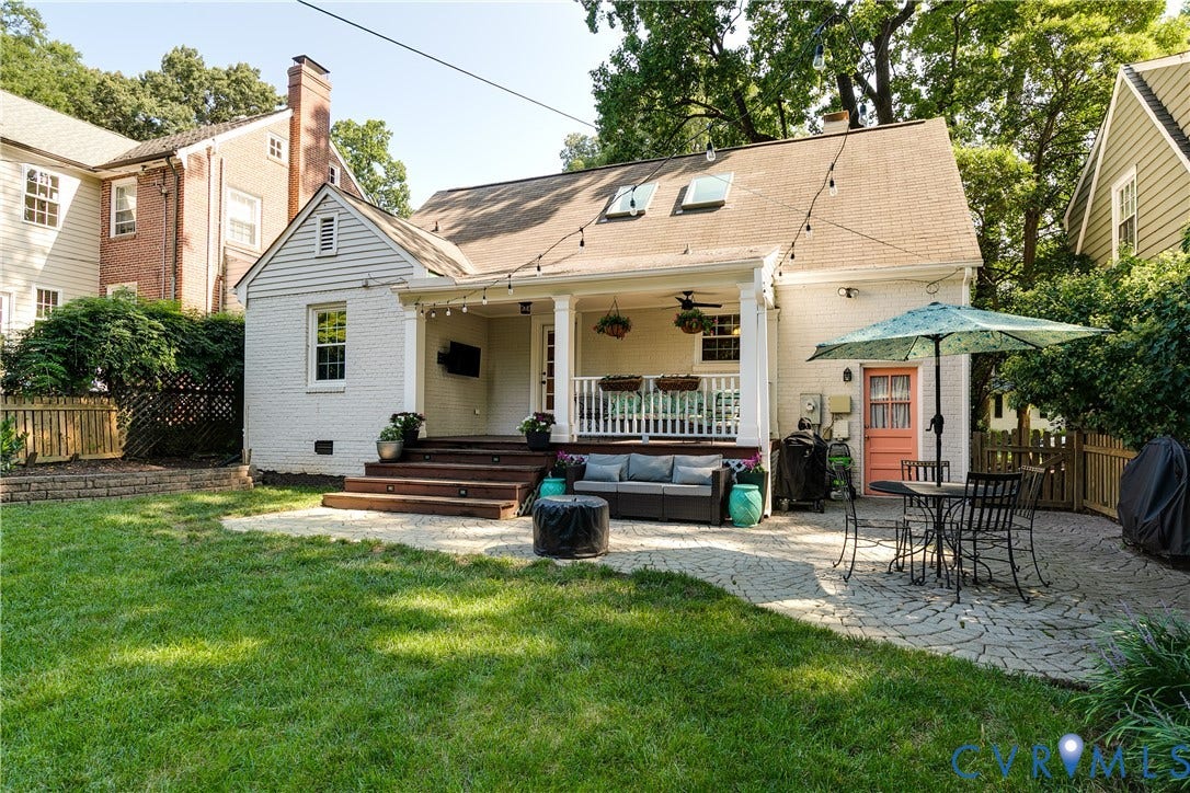 5204 Caledonia Road, Westover Hills, Richmond, VA 23225 Expansive backyard featuring a covered porch, wood-tone deck, skylights, and a stone paver patio