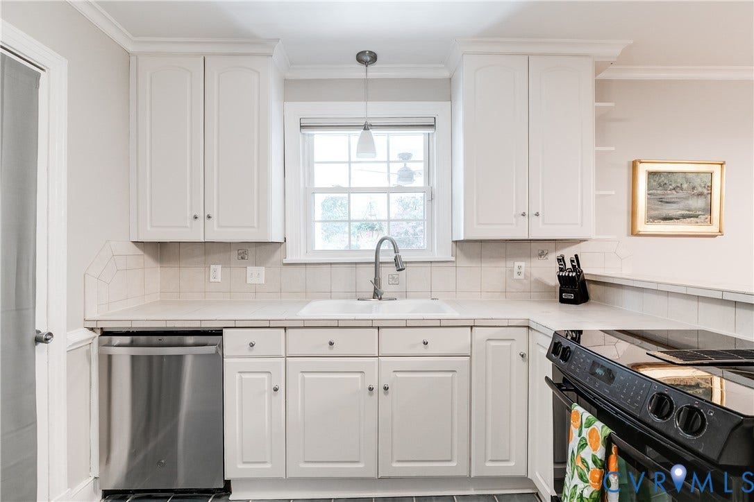 5204 Caledonia Road, Westover Hills, Richmond, VA 23225 White cabinetry with crown molding, stainless steel dishwasher, undermount sink with a gooseneck faucet, light-toned tiled countertops, and a black electric range