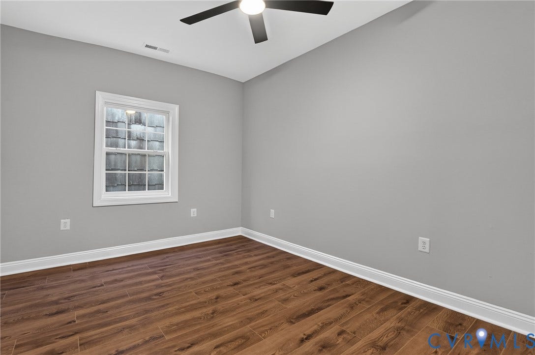 526 N 33rd Street, Church Hill, Richmond, VA 23223 Bedroom #2, LVP-finish flooring, light grey painted walls, white window trim, and a ceiling fan with integrated lighting, closet