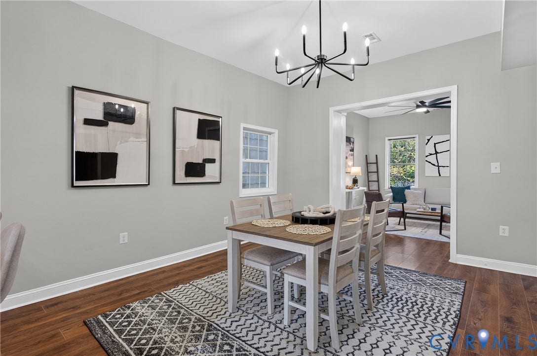 526 N 33rd Street, Church Hill, Richmond, VA 23223 LVP-finish flooring, a contemporary chandelier, light gray wall paint, Sliding Barn Doors, built in wine rack, and white window trim