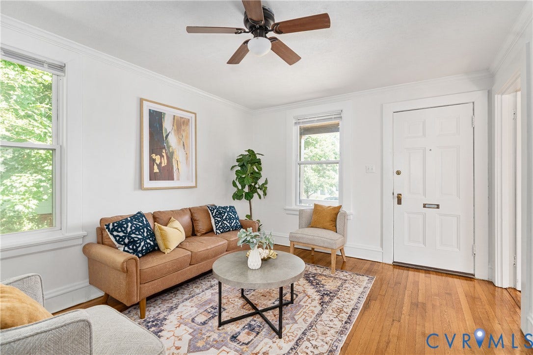 3401 Rosewood Avenue, Carytown, Richmond, VA 23221 Living space featuring wood-finish flooring, two large windows, a panel door, and crown molding