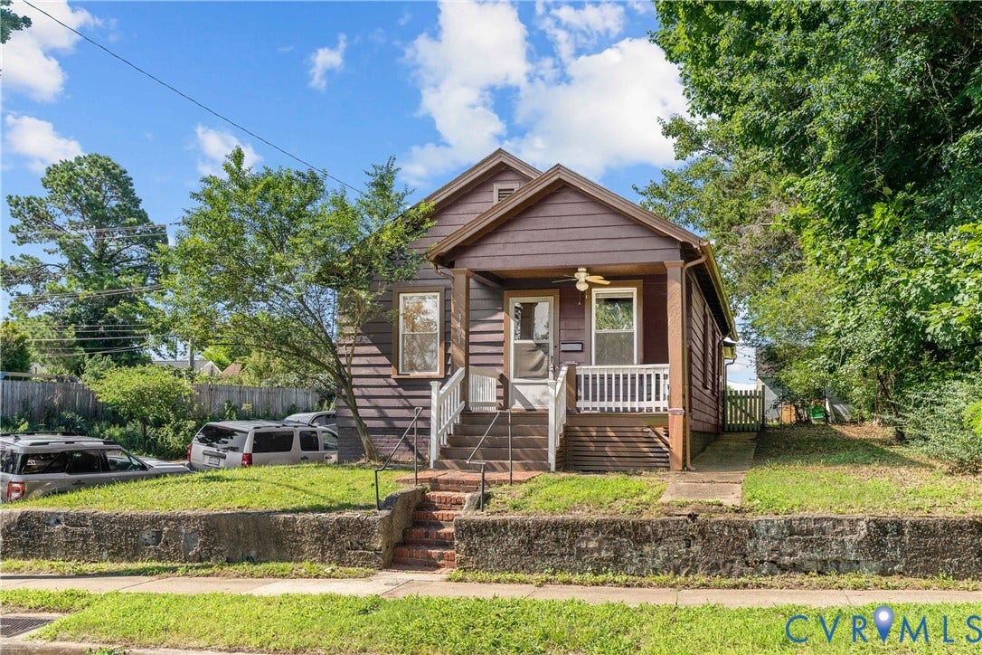 3401 Rosewood Avenue, Carytown, Richmond, VA 23221 Brown wood-sided residence featuring a covered front porch with white railing