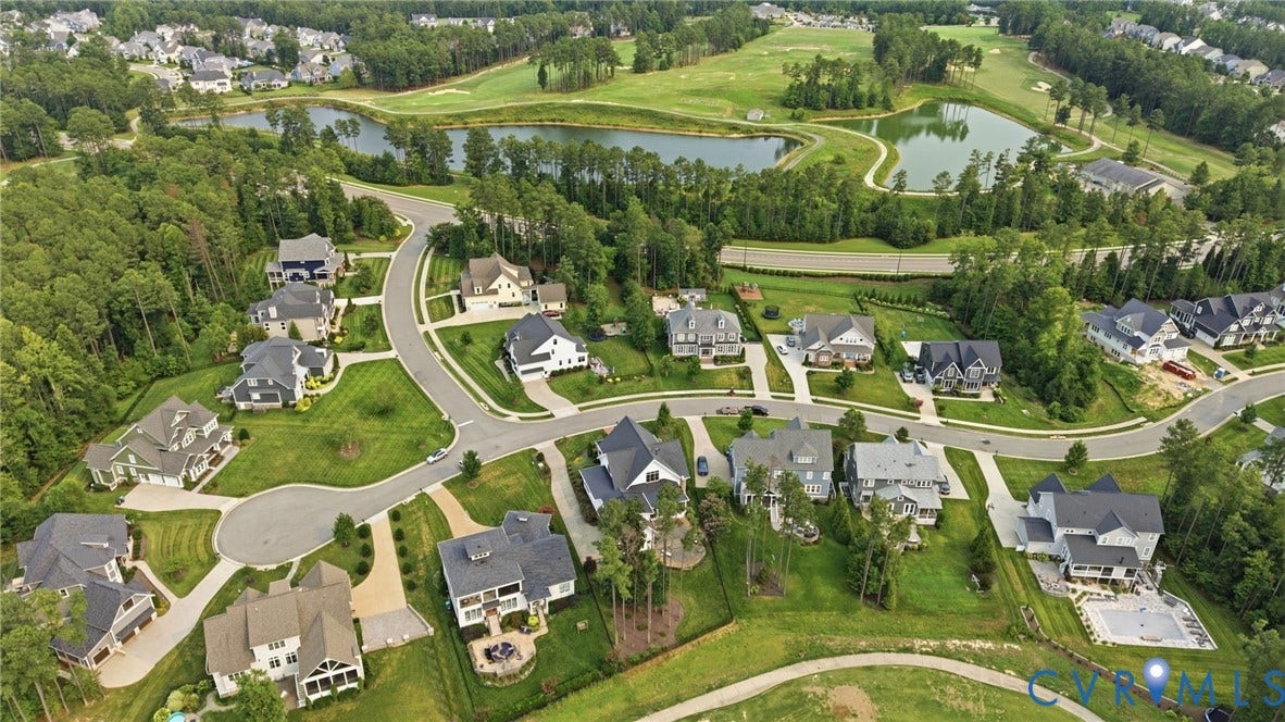 Aerial perspective showcasing a residential community with winding streets and cul-de-sacs