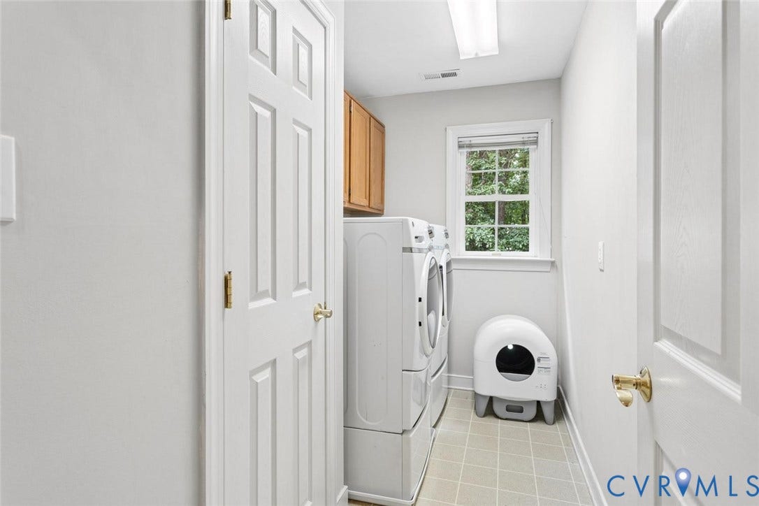 6001 Olde Hartley Place, Glen Allen, VA 23060 Laundry room featuring light-toned tile flooring, a window with exterior views, and upper cabinetry
