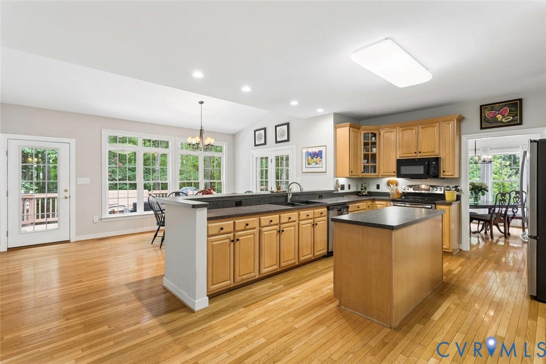 6001 Olde Hartley Place, Glen Allen, VA 23060 Hardwood flooring throughout, kitchen with wood cabinetry, center island, and dark countertops
