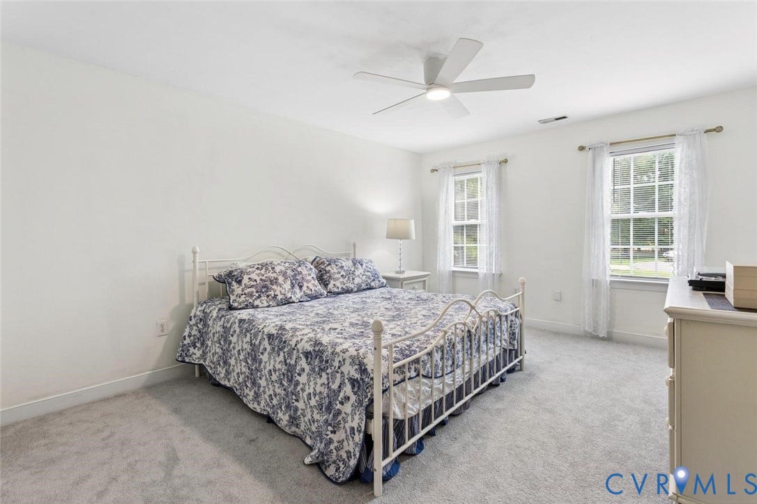 6001 Olde Hartley Place, Glen Allen, VA 23060 Plush carpeting, two double-hung windows, a ceiling fan with integrated lighting, and white wall finishes