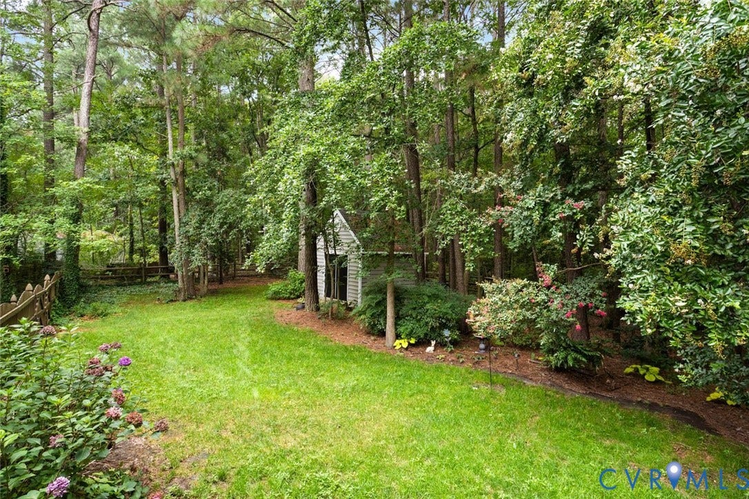 6001 Olde Hartley Place, Glen Allen, VA 23060 Expansive lawn area, mature trees, wood privacy fence, garden shed structure, and established landscaping