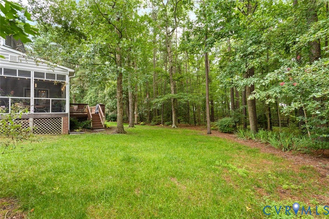 6001 Olde Hartley Place, Glen Allen, VA 23060 Expansive backyard featuring a screened porch, wood deck, and mature trees