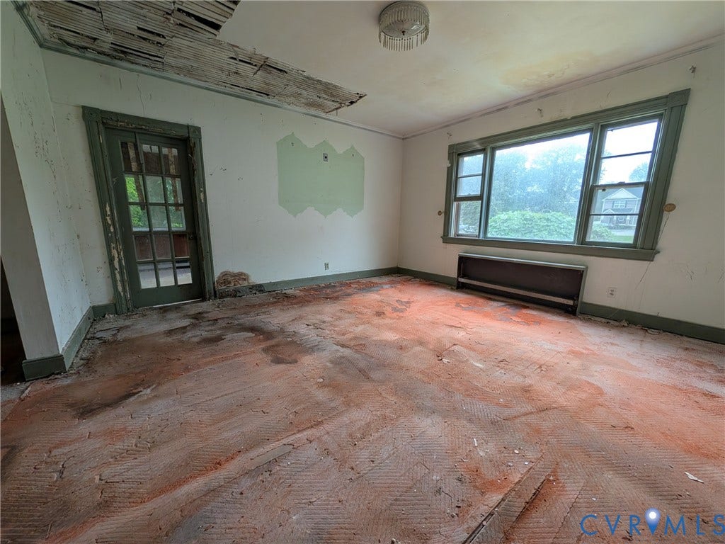 1409 Hungary Road, Richmond, VA 23228 Room with exposed subfloor, a multi-pane window, and a glass-paneled door