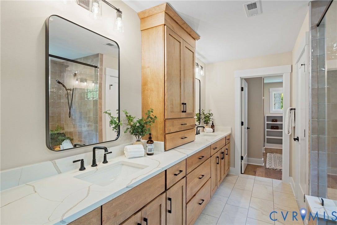 Dual vanity with integrated sinks and white countertops