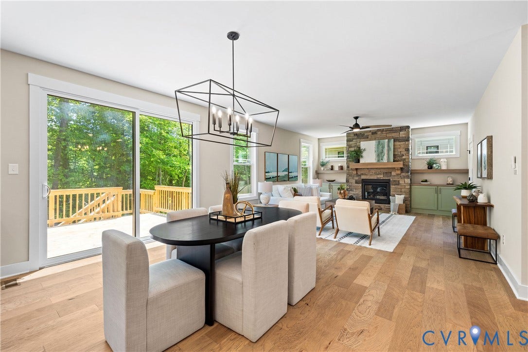 Open concept living area featuring wood-finish flooring