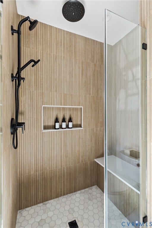 3142 Floyd Avenue, Museum District, Richmond, VA 23221 Walk-in shower with vertical ribbon tile walls, matte black multi-function shower system, ceiling-mounted rainfall showerhead, and hexagonal tile flooring