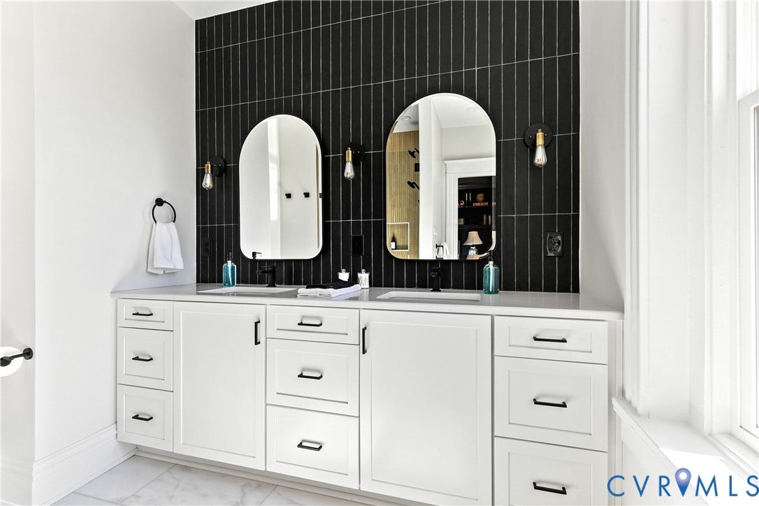 3142 Floyd Avenue, Museum District, Richmond, VA 23221 Double vanity featuring white shaker-style cabinetry, matte black hardware, and a light-toned countertop