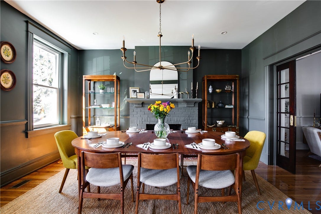 3142 Floyd Avenue, Museum District, Richmond, VA 23221 Formal dining space with a fireplace featuring a brick surround and mantel