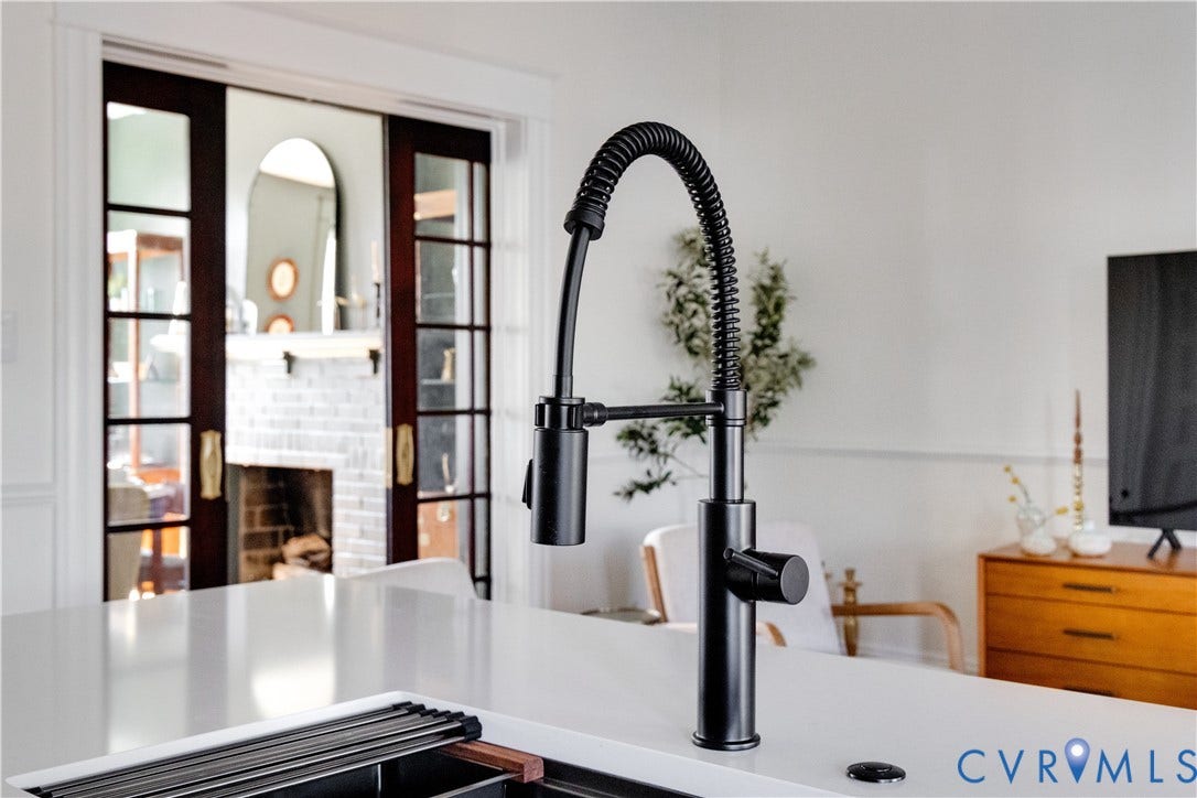 3142 Floyd Avenue, Museum District, Richmond, VA 23221 Contemporary black kitchen faucet with a coiled hose and pull-down sprayer
