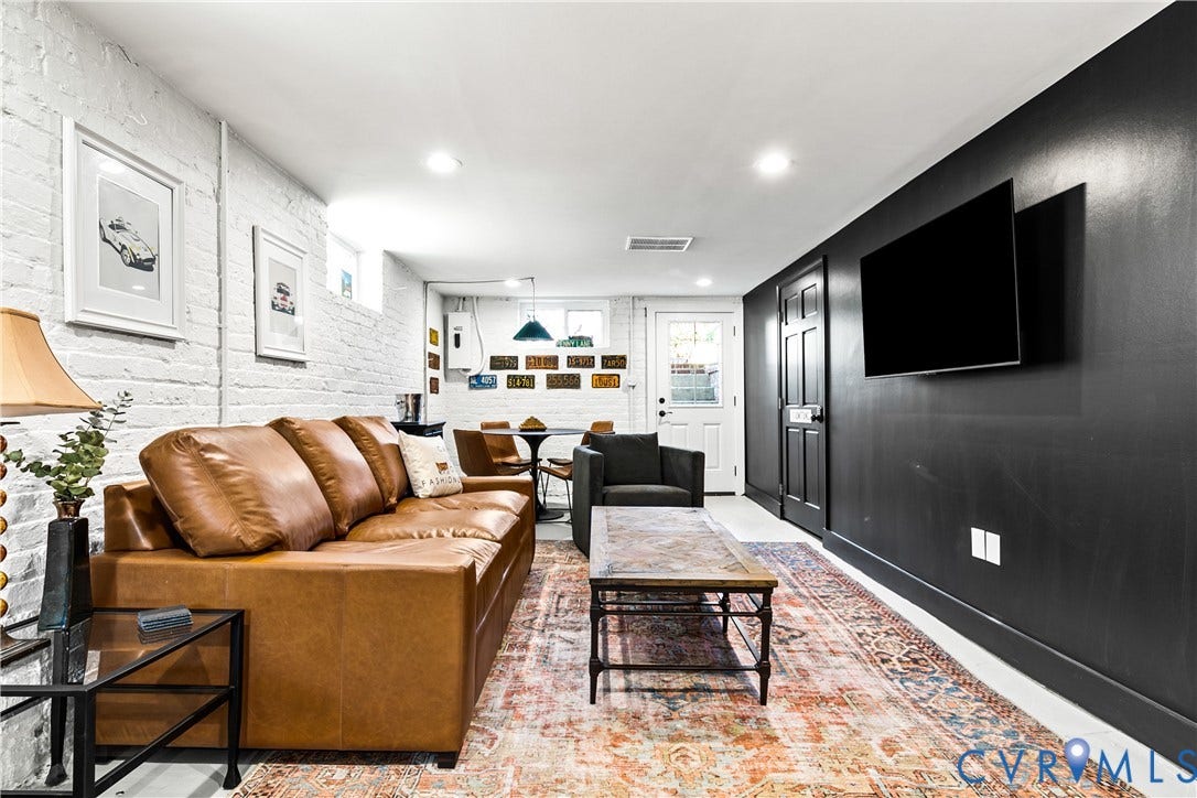 3142 Floyd Avenue, Museum District, Richmond, VA 23221 Finished basement level featuring white painted brick walls, recessed lighting, and a dark accent wall