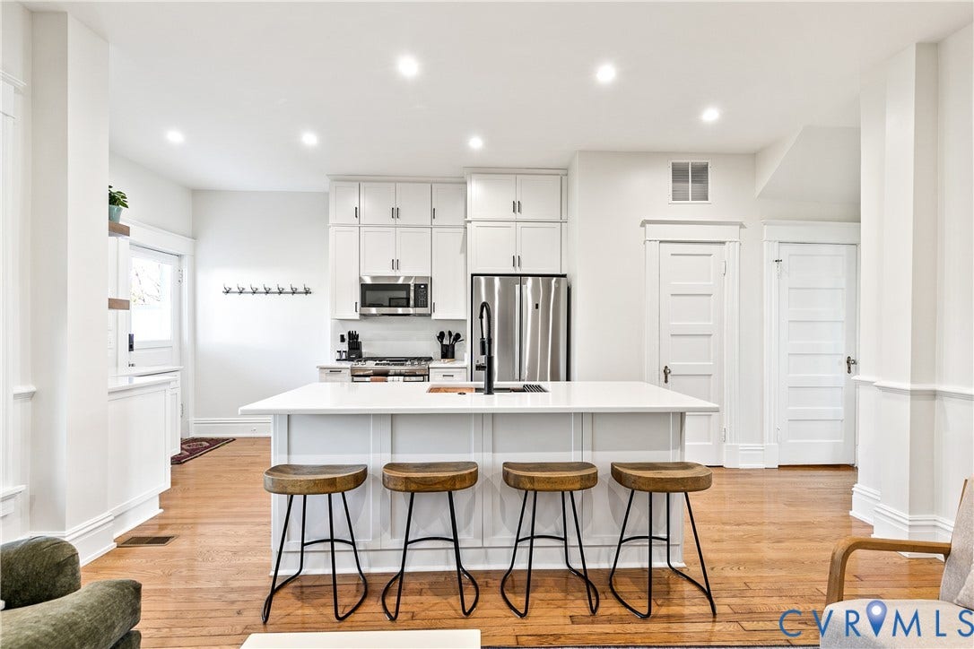 3142 Floyd Avenue, Museum District, Richmond, VA 23221 Open-concept kitchen featuring a large island with a white countertop, extensive white cabinetry, recessed lighting, and stainless steel appliances