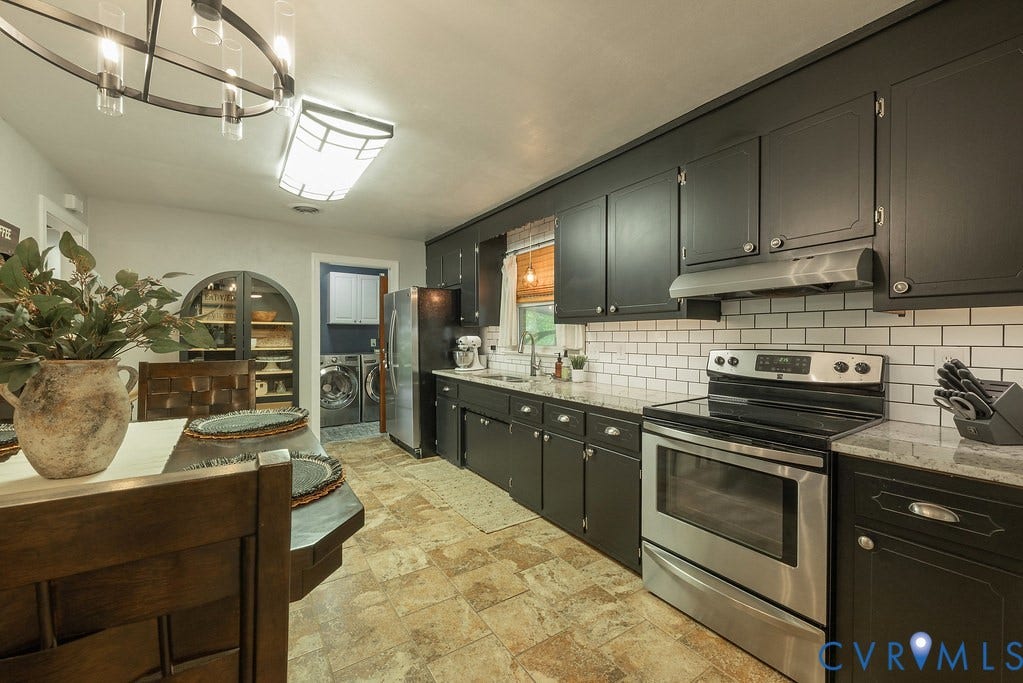 Painted cabinets, Granite countertops and tile backsplash.