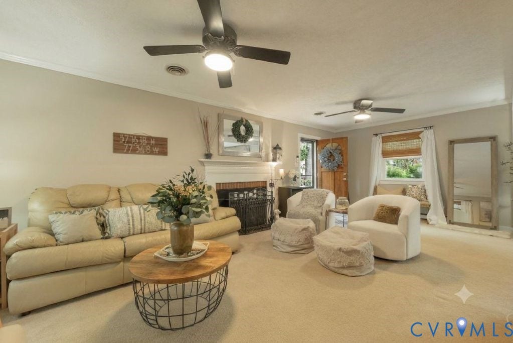 Spacious Family Room with Brick Fireplace and side entry access.