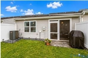 7225 Lyon Taylor Lane, The Groves At New Kent, New Kent, VA 23124 Private fenced yard featuring a patio, sliding glass door with a screen, and an exterior window
