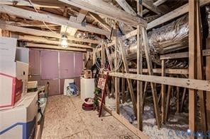 7225 Lyon Taylor Lane, The Groves At New Kent, New Kent, VA 23124 Unfinished attic space featuring exposed wood framing and flooring, with visible insulation and ductwork