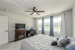 7225 Lyon Taylor Lane, The Groves At New Kent, New Kent, VA 23124 Bedroom featuring a ceiling fan with integrated lighting, a built-in electric fireplace with a wood-finish mantel, and three large windows