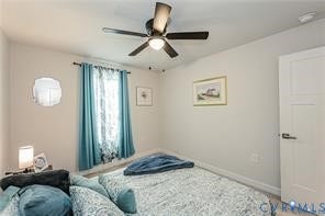 7225 Lyon Taylor Lane, The Groves At New Kent, New Kent, VA 23124 Interior room featuring a ceiling fan, light-toned walls, a window with drapery, and a white paneled door