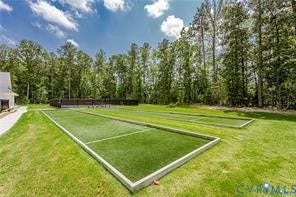 7225 Lyon Taylor Lane, The Groves At New Kent, New Kent, VA 23124 Expansive outdoor recreation area featuring two artificial turf bocce ball courts with concrete borders