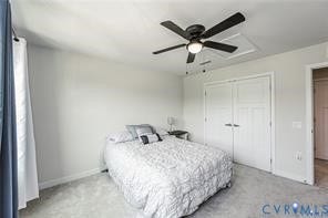 7225 Lyon Taylor Lane, The Groves At New Kent, New Kent, VA 23124 Carpeted room featuring a ceiling fan with light fixture, light gray walls, and a double-door closet with white paneled doors