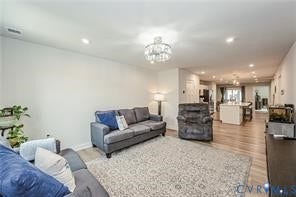 7225 Lyon Taylor Lane, The Groves At New Kent, New Kent, VA 23124 Open-concept living area featuring light-toned walls, recessed lighting, and wood-finish flooring