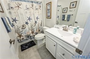 7225 Lyon Taylor Lane, The Groves At New Kent, New Kent, VA 23124 Bathroom with a white vanity featuring an integrated sink, brushed nickel faucet, and a large wall-mounted mirror