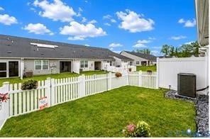 7225 Lyon Taylor Lane, The Groves At New Kent, New Kent, VA 23124 Fenced backyard featuring a manicured lawn, white picket fencing, and a white privacy fence
