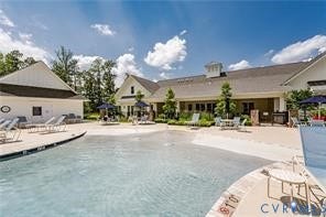 7225 Lyon Taylor Lane, The Groves At New Kent, New Kent, VA 23124 Expansive swimming pool featuring a zero-entry design and surrounding concrete deck