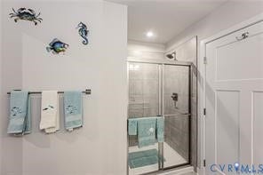 7225 Lyon Taylor Lane, The Groves At New Kent, New Kent, VA 23124 Modern shower enclosure with sliding glass doors, a rainfall shower head, and light-toned tile surround