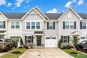 7225 Lyon Taylor Lane, The Groves At New Kent, New Kent, VA 23124 Contemporary townhome featuring light gray siding, dark shutters, and a white garage door