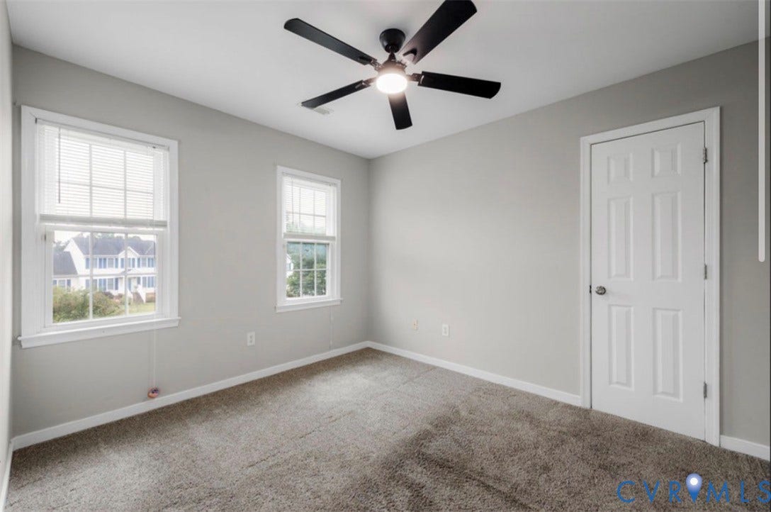 2912 Appleford Drive, Longmeadow, Chester, VA 23831 Two windows with blinds, neutral wall paint, and a ceiling fan with integrated lighting