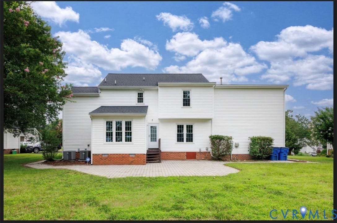 2912 Appleford Drive, Longmeadow, Chester, VA 23831 Rear exterior featuring white siding, a dark shingle roof, and a red brick foundation
