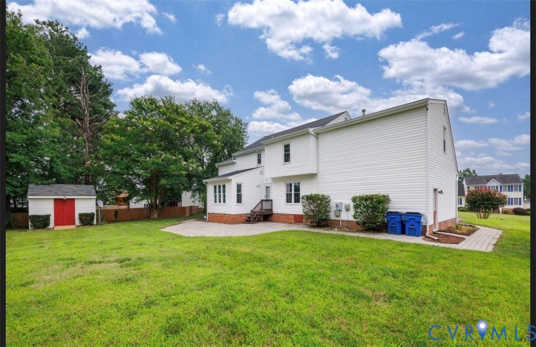 2912 Appleford Drive, Longmeadow, Chester, VA 23831 Expansive backyard featuring a white siding residence with a patio area and a separate storage shed