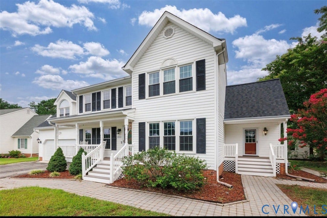 2912 Appleford Drive, Longmeadow, Chester, VA 23831 White siding exterior with black shutters, featuring a covered front porch with white railings, a second covered entry, a paved walkway, and landscaping with mature shrubs