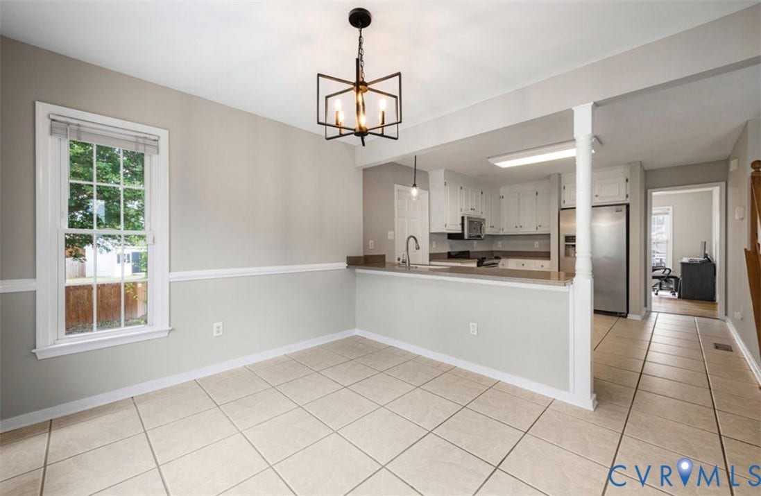 2912 Appleford Drive, Longmeadow, Chester, VA 23831 Tiled flooring, chair rail molding, and a modern chandelier
