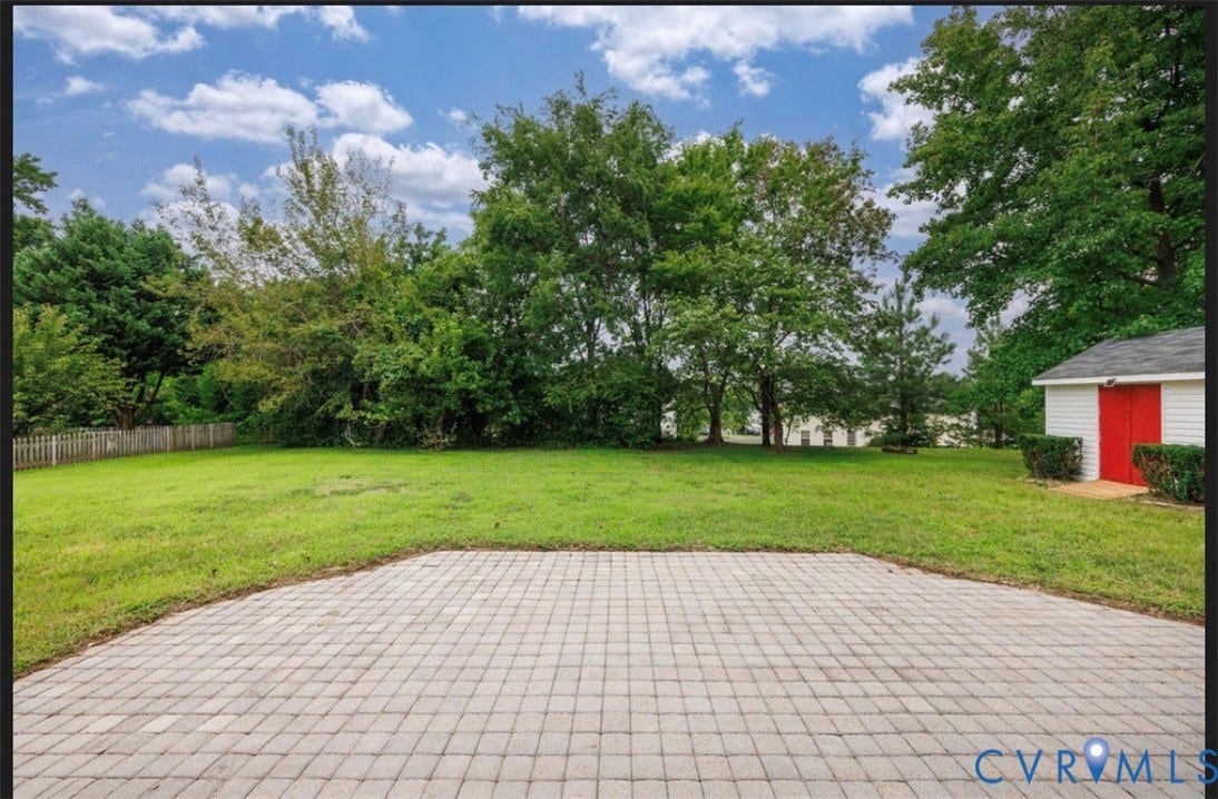 2912 Appleford Drive, Longmeadow, Chester, VA 23831 Expansive backyard featuring a paver patio, spacious lawn, and mature trees