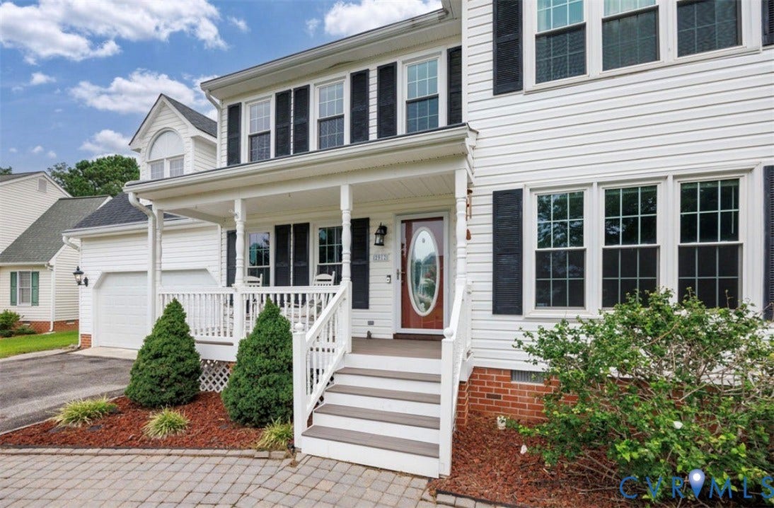 2912 Appleford Drive, Longmeadow, Chester, VA 23831 Traditional-style residence featuring white siding, a covered front porch with white railings, and a red brick foundation