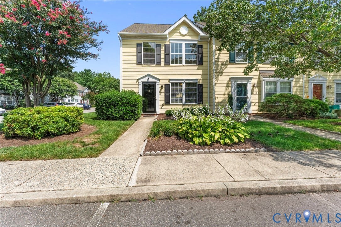 10111 Robin Lee Lane, Henrico, VA 23060 Charming two-story colonial with cream-colored siding and black shuttered windows