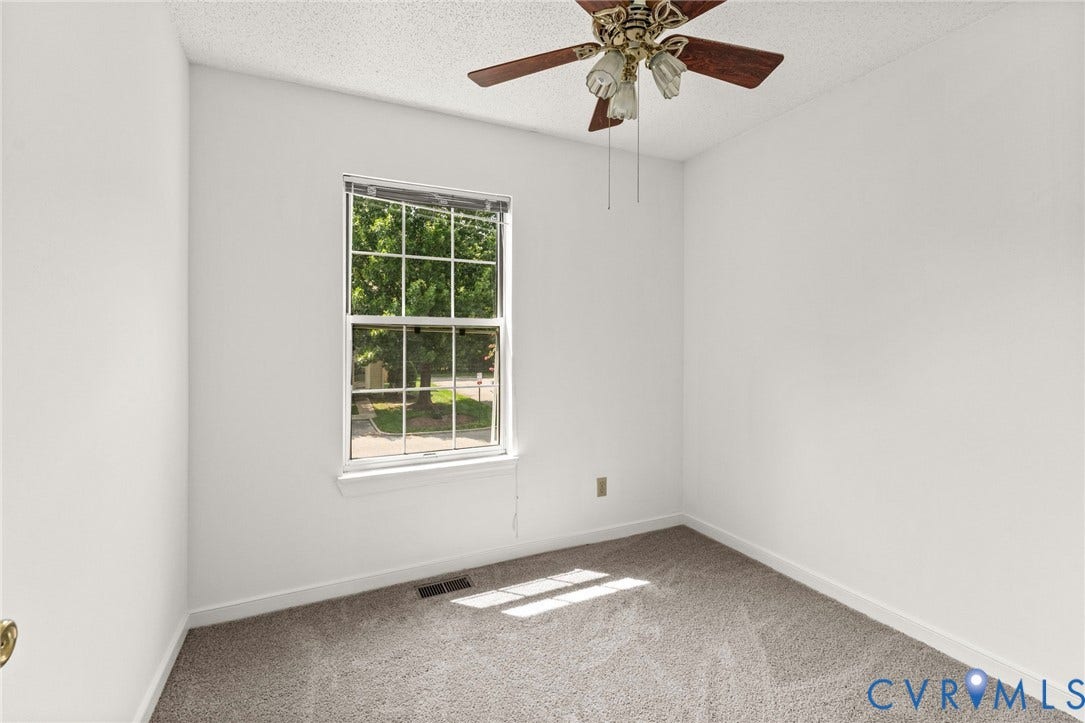 10111 Robin Lee Lane, Henrico, VA 23060 Neutral wall finishes, textured carpeting, double-hung window, and a ceiling fan