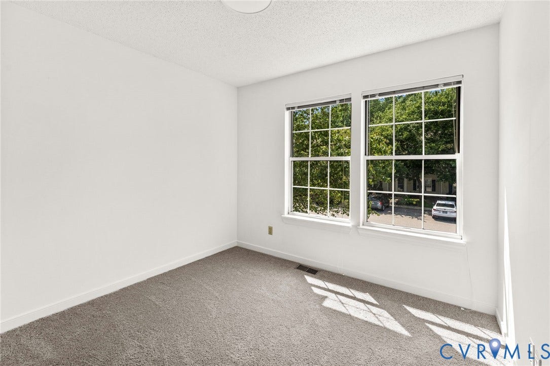 10111 Robin Lee Lane, Henrico, VA 23060 Neutral wall paint, textured ceiling, carpet flooring, and two multi-pane windows