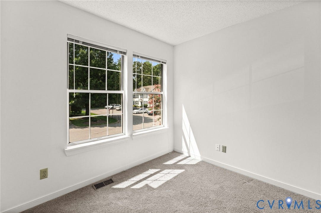 10111 Robin Lee Lane, Henrico, VA 23060 Bright corner room flooded with natural light through dual multi-pane windows with white frames