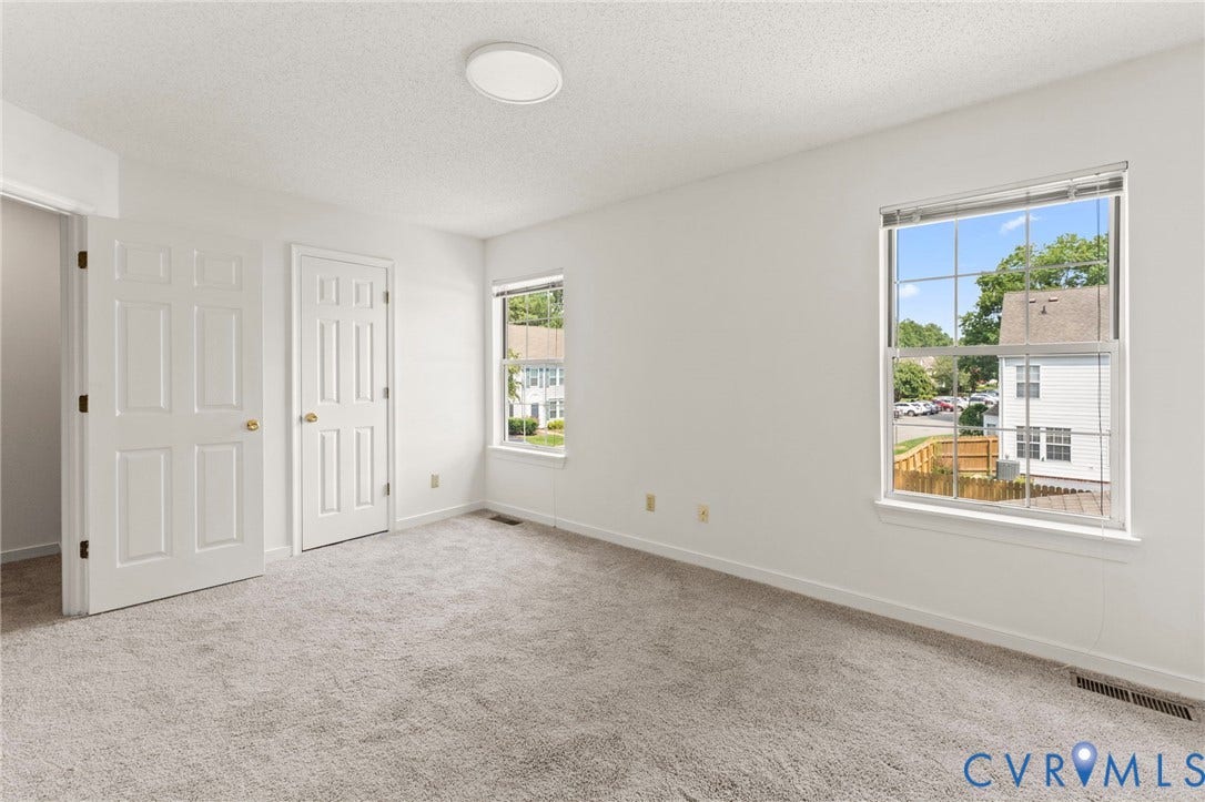 10111 Robin Lee Lane, Henrico, VA 23060 Bright, light-filled bedroom offering abundant natural light through a large picture window
