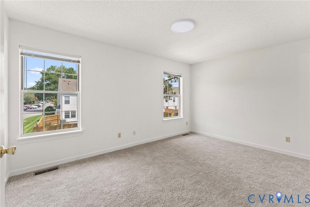 10111 Robin Lee Lane, Henrico, VA 23060 Bright and spacious bedroom flooded with natural light from dual windows